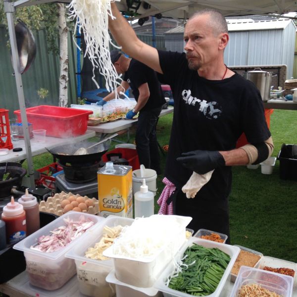 Simon separating noodles and ingredients